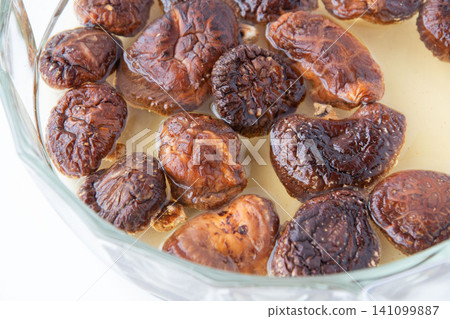 Rehydrating dried shiitake mushrooms Rehydrating dried shiitake mushrooms 141099887