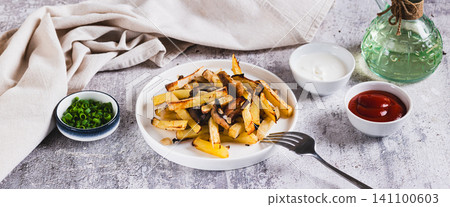Delicious French fries with mushrooms on a plate on the table web banner Delicious French fries with mushrooms on a plate on the table web banner 141100603