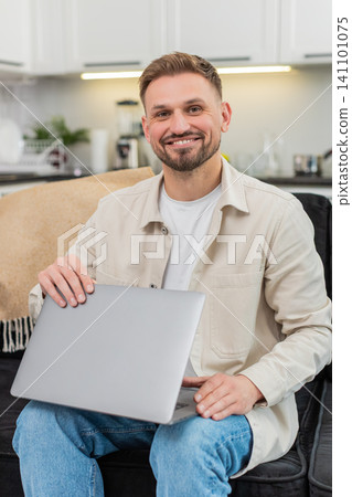 Young man closes laptop after tasks exhales with relief work finished calm relaxed mood success end Young man closes laptop after tasks exhales with relief work finished calm relaxed mood success end 141101075