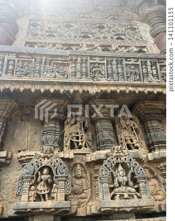 Relief carvings on the stone walls of Hindu temples, ancient ruins, depicting gods and dancers in intricate detail. Relief carvings on the stone walls of Hindu temples, ancient ruins, depicting gods and dancers in intricate detail. 141101155