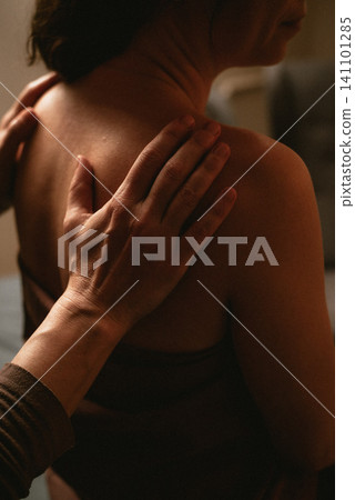 Back massage with hands close-up Back massage with hands close-up 141101285