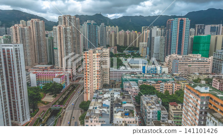 Hong Kong. July 5 2026 San Po Kong Skyline Beneath Dramatic Mountain 141101426
