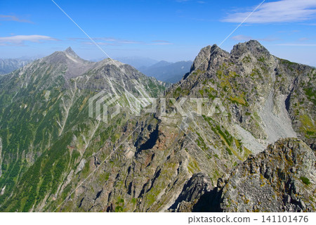 A view of Takidani Dome and Kitahotaka-dake from the middle of Karasawa-dake in the Northern Alps, with Yarigatake in the background. 141101476