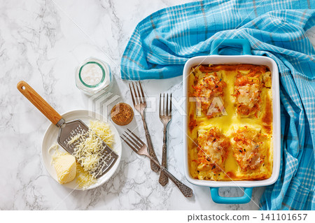 Cheesy Veggie Baked White Fish in blue baking dish Cheesy Veggie Baked White Fish in blue baking dish 141101657