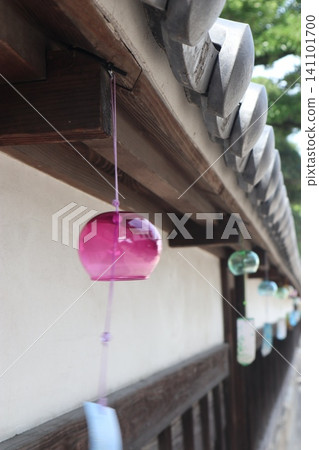 Wind chimes hung under the eaves 141101700