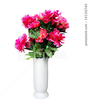 Red plastic flowers in a white vase against a white background. Red plastic flowers in a white vase against a white background. 141102583