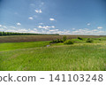 Sunny rural meadow with rolling fields and distant horizon Sunny rural meadow with rolling fields and distant horizon 141103248