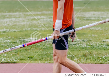 Athlete with pole in his hand Athlete with pole in his hand 141103625
