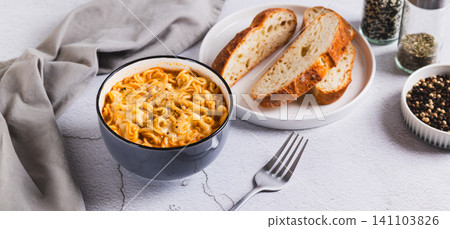 Hot Korean ramen with melted cheese in a bowl on the table web banner Hot Korean ramen with melted cheese in a bowl on the table web banner 141103826