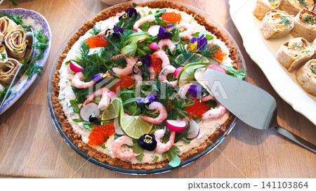 Salad cake with shrimp, red caviar, flowers, lime Salad cake with shrimp, red caviar, flowers, lime 141103864