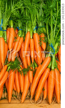 Fresh Organic Carrots with Green Tops at Farmers Market Fresh Organic Carrots with Green Tops at Farmers Market 141103913