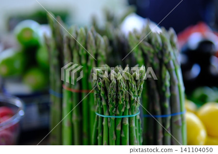 asparagus at market. Asparagus. Fresh bundles green asparagus on market place. asparagus at market. Asparagus. Fresh bundles green asparagus on market place. 141104050