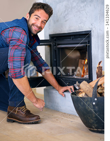 Fireplace, fire and portrait of man in home for heat, warmth and light in winter with wood. Flame, burning and person with firewood or log for comfortable, cozy and relaxing house in living room Fireplace, fire and portrait of man in home for heat, warmth and light in winter with wood. Flame, burning and person with firewood or log for comfortable, cozy and relaxing house in living room 141104629