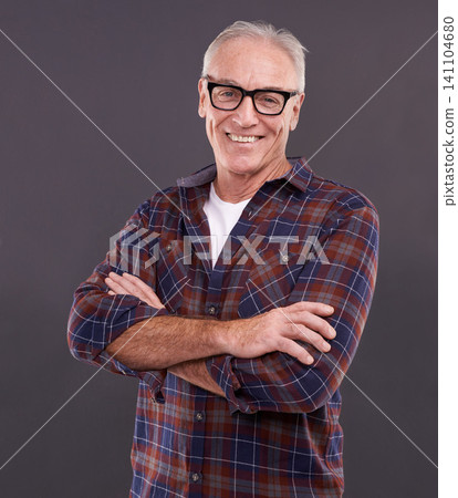 Mature man, fashion and glasses with happiness in studio on black background for eyewear, optometry and satisfied. Portrait, smile and style or casual outfit with positivity, arms crossed and enjoy. Mature man, fashion and glasses with happiness in studio on black background for eyewear, optometry and satisfied. Portrait, smile and style or casual outfit with positivity, arms crossed and enjoy. 141104680