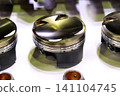 A piston for a supercharged engine with a coated skirt section. 141104745