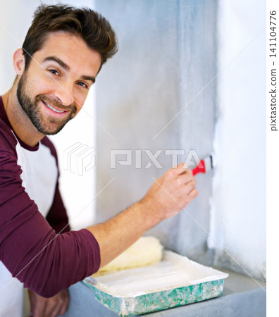 Painting, wall and portrait of man in home for renovation, remodeling and maintenance. Interior design, construction and person with paintbrush, roller and paint equipment for DIY project in house Painting, wall and portrait of man in home for renovation, remodeling and maintenance. Interior design, construction and person with paintbrush, roller and paint equipment for DIY project in house 141104776