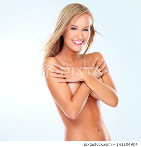 Hair, portrait and skincare of nude woman with smile, makeup or body in studio isolated on blue background mockup space. Hairstyle, face or naked blonde model in cosmetics at salon for beauty or wind 141104904