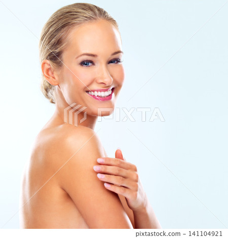 Studio, skincare and portrait of woman with smile for collagen treatment, dermatology or facial glow. Female person, happy and confidence with self care, healthy skin or wellness on blue background 141104921