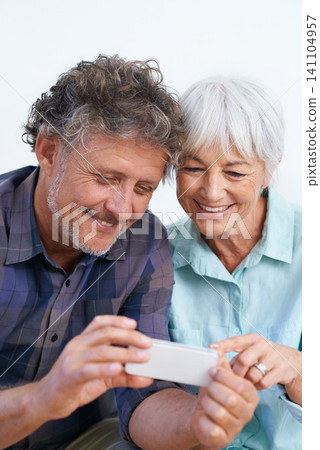 Smile, cellphone and mature couple networking internet, mobile app or website together for bonding. Happy, love and senior man and woman reading online blog for information with phone for marriage. Smile, cellphone and mature couple networking internet, mobile app or website together for bonding. Happy, love and senior man and woman reading online blog for information with phone for marriage. 141104957