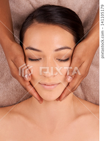 Facial massage, relax and woman for wellness spa, detox and resting in luxury resort. Skincare, top view and face of calm female person for self care, exfoliate and beauty treatment in salon Facial massage, relax and woman for wellness spa, detox and resting in luxury resort. Skincare, top view and face of calm female person for self care, exfoliate and beauty treatment in salon 141105179