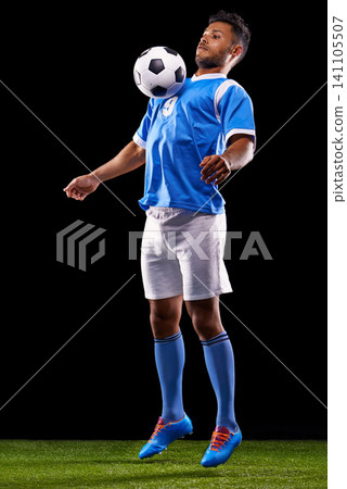 Man, soccer ball and play for sport, fitness and game for active and sportswear on grass or field. Arab person, sportsman or athlete and practice for strong and competitive on dark background Man, soccer ball and play for sport, fitness and game for active and sportswear on grass or field. Arab person, sportsman or athlete and practice for strong and competitive on dark background 141105507