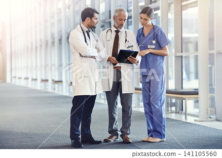 Doctors, expert and team in hospital with notes for diagnosis, discussion and health for medic and treatment. Young people or colleague with stethoscope for healthcare, medical and medicine on mockup 141105560