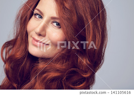 Ginger, beauty and portrait of woman with hair care in studio, background and mockup. Cosmetics, makeup and red dye for natural shine and color on hairstyle or healthy skincare from dermatology 141105616