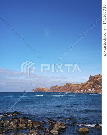 Winter in Hokkaido's Shakotan Peninsula: A view of Cape Kamui from Kamimisaki Fishing Port. 141105716