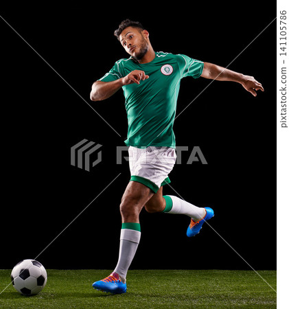 Man, ball and soccer for sport and fitness for game, active and sportswear on grass or field. Role model, athlete or player and practice for kick, competitive and score in night on dark background Man, ball and soccer for sport and fitness for game, active and sportswear on grass or field. Role model, athlete or player and practice for kick, competitive and score in night on dark background 141105786