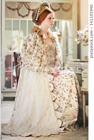 Woman, queen and royal in luxury, renaissance aesthetic and wealth with cosplay, regal and history. Monarch, elegant dress or costume with Shakespeare, vintage or medieval with palace or castle 141105940