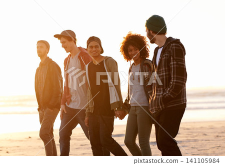 Diverse, couple of friends and walk at beach with smile for bonding with holding hands, support, care and vacation in New York. People, talking and relax on summer holiday for adventure and happy Diverse, couple of friends and walk at beach with smile for bonding with holding hands, support, care and vacation in New York. People, talking and relax on summer holiday for adventure and happy 141105984