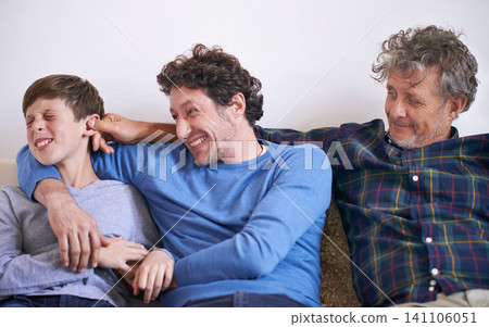 Happy, playing and boy with father and grandfather on sofa in living room for funny, comic or comedy. Smile, laughing and young child bonding with dad and senior man for fun together at home. Happy, playing and boy with father and grandfather on sofa in living room for funny, comic or comedy. Smile, laughing and young child bonding with dad and senior man for fun together at home. 141106051