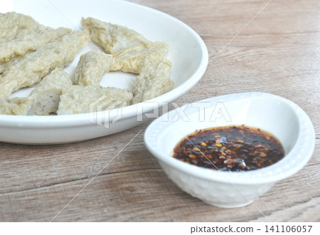deep fried crispy rugby fish ball on plate dipping sweet and spicy chili tamarind sauce deep fried crispy rugby fish ball on plate dipping sweet and spicy chili tamarind sauce 141106057