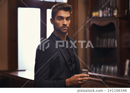 Businessman, confident portrait or alcohol on break in hotel or drink to relax on corporate trip. Entrepreneur, pub or serious face by glass of whisky for leisure or young professional on work travel Businessman, confident portrait or alcohol on break in hotel or drink to relax on corporate trip. Entrepreneur, pub or serious face by glass of whisky for leisure or young professional on work travel 141106346