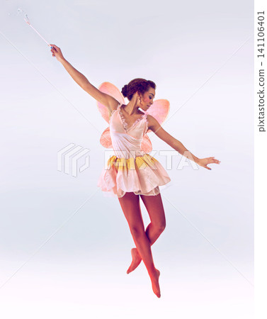 Woman, fairy and dancer for wand in studio for fantasy, flight and balance with moving by white background. Person, jump and girl for magic, ballet and butterfly wings for steps, art and creativity Woman, fairy and dancer for wand in studio for fantasy, flight and balance with moving by white background. Person, jump and girl for magic, ballet and butterfly wings for steps, art and creativity 141106401