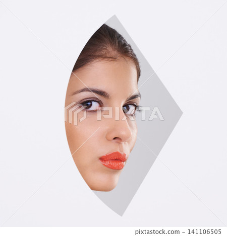 Young woman, portrait and makeup in a cutout and studio for cosmetics, skincare and dermatology. Face of model in beauty and foundation with geometric closeup and creative shape on a white background Young woman, portrait and makeup in a cutout and studio for cosmetics, skincare and dermatology. Face of model in beauty and foundation with geometric closeup and creative shape on a white background 141106505