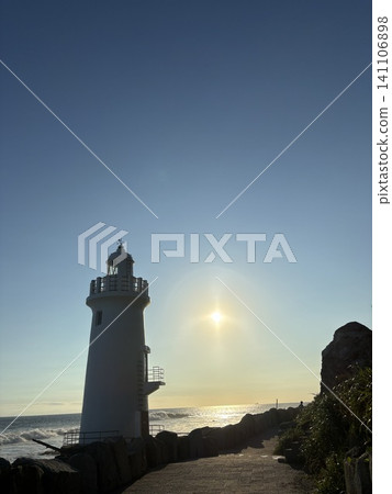 Lighthouse bathed in the setting sun Lighthouse bathed in the setting sun 141106898