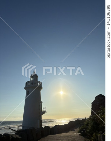 Lighthouse bathed in the setting sun Lighthouse bathed in the setting sun 141106899