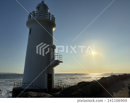 Lighthouse bathed in the setting sun Lighthouse bathed in the setting sun 141106909