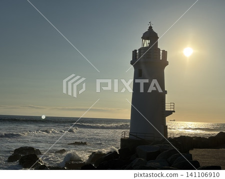 Lighthouse bathed in the setting sun Lighthouse bathed in the setting sun 141106910