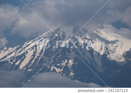 Majestic snow peak of mount Ararat in clouds with blue sky copy space 141107123