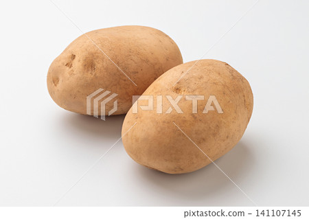Two Baron potatoes placed against a white background. Two Baron potatoes placed against a white background. 141107145