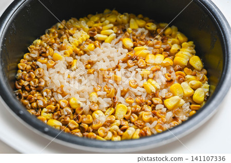 Roasted corn rice cooked in a rice cooker 141107336