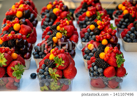 Fresh fruits stacked in cups at a market in Prague during the summer season Fresh fruits stacked in cups at a market in Prague during the summer season 141107496