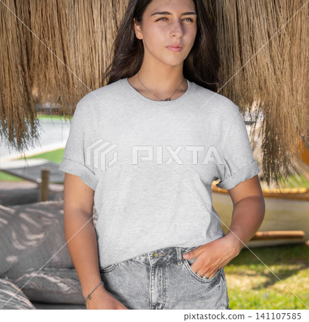 Blank heather grey shirt mockup, young woman outdoors on a sunny day, front view with copy space Blank heather grey shirt mockup, young woman outdoors on a sunny day, front view with copy space 141107585