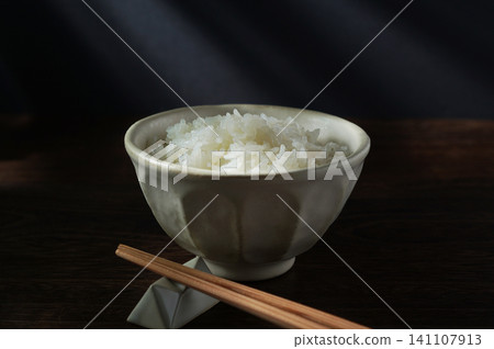 White rice served in a bowl. White rice served in a bowl. 141107913