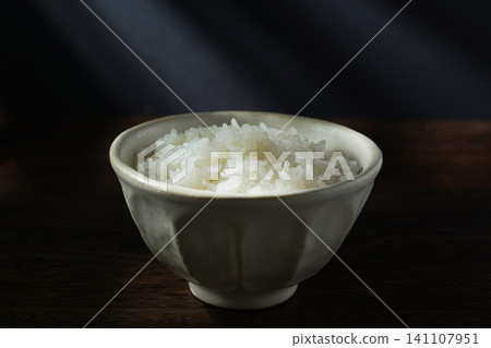 White rice served in a bowl. White rice served in a bowl. 141107951