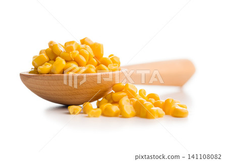Close-Up of Yellow Corn Kernels in a Wooden Spoon on White Background Close-Up of Yellow Corn Kernels in a Wooden Spoon on White Background 141108082