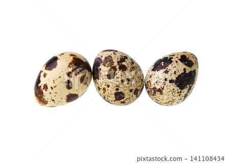 Three quail eggs lined up side by side Three quail eggs lined up side by side 141108434