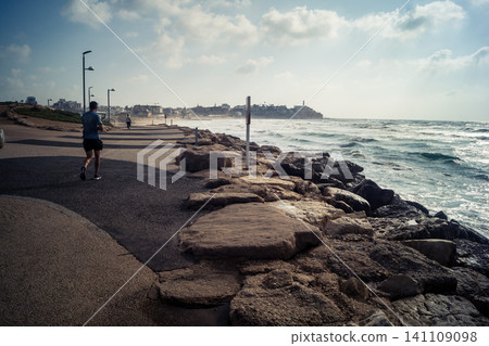 Waves crashing against the rocky coastline with a view of the Mediterranean Sea in Tel Aviv 141109098